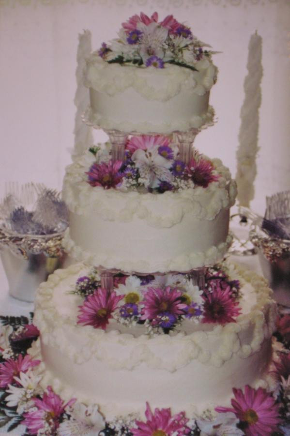 Wedding Cakes With Columns
 Pink Lavender and white daisy buttercream wedding cake