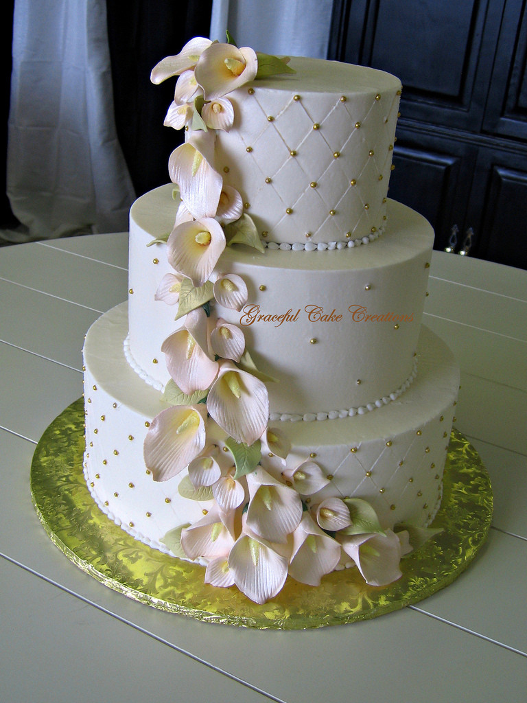 Wedding Cakes With Lilies
 Elegant Ivory and Gold Wedding Cake with Champagne Colored