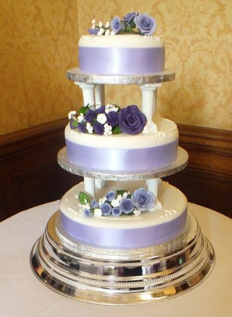 Wedding Cakes With Pillars
 3 tier lavender and white wedding cake pillars between