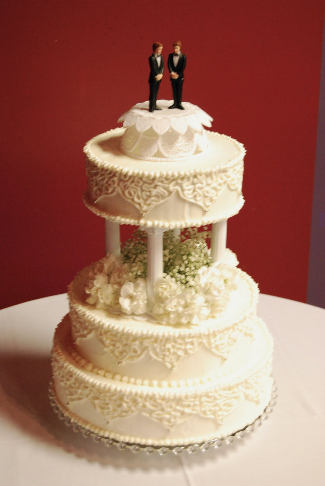 Wedding Cakes With Pillars
 Everything Is Frosted Traditional wedding cake with