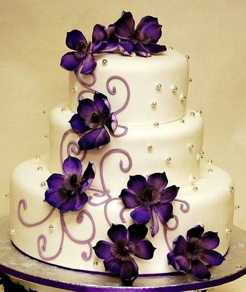 Wedding Cakes With Purple
 White 3 tier wedding cake with purple flowers and silver