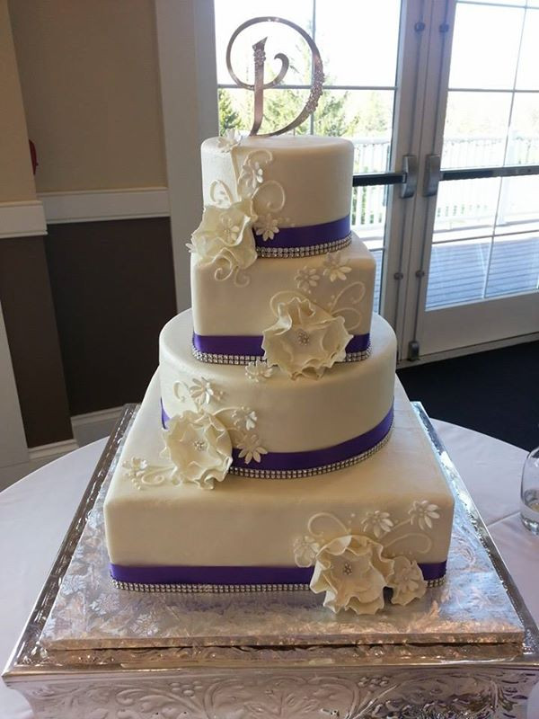 White And Purple Wedding Cake
 Four Tiered Wedding Cakes