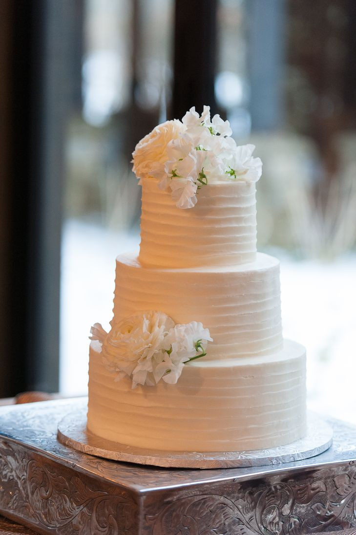 White Buttercream Wedding Cake
 White Lisianthus Topped Textured White Buttercream Wedding