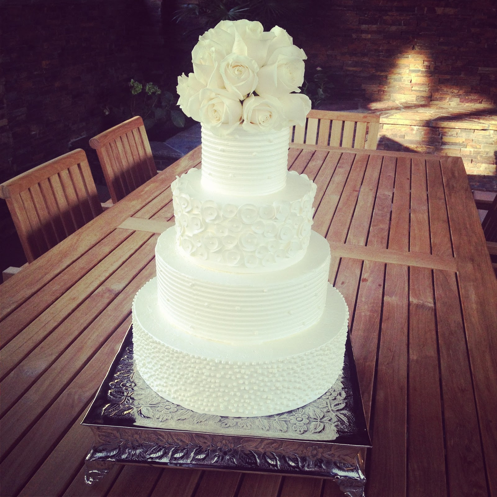 White Buttercream Wedding Cake
 BAKESHOPmarie white buttercream wedding cake with white roses
