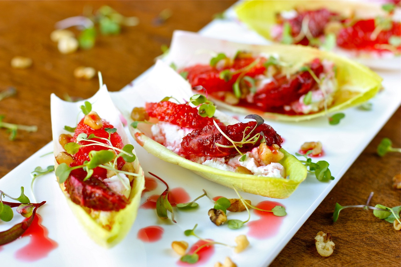 Light Christmas Appetizers
 endive stuffed with goat cheese blood orange and walnuts